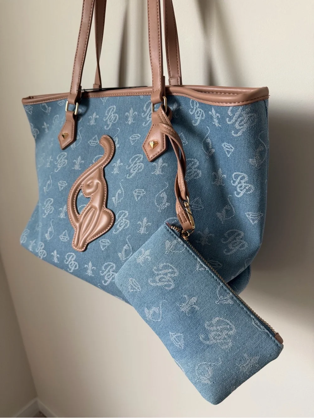 Baby Phat Blue Denim monogram Tote bag with Brown leather Trim and pouch.